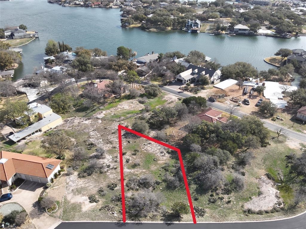 View of property location with a nearby body of water and property boundaries highlighted