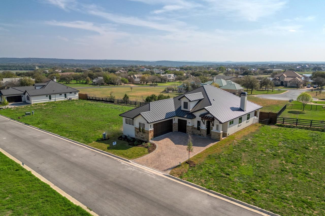 Love the roof line and having not only 2 garages but a golf cart garage as well!