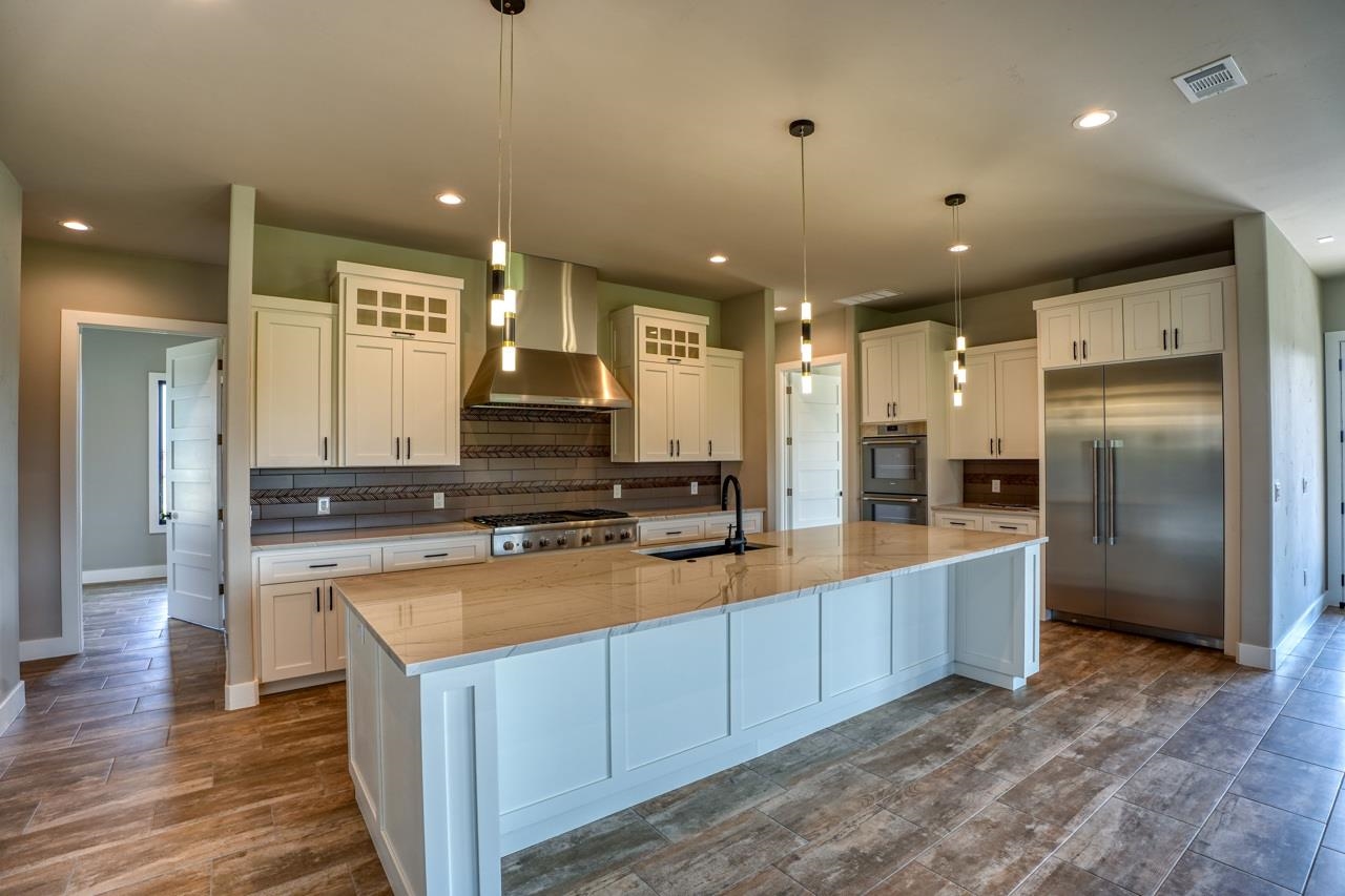 Million-dollar home kitchen. Thermador appliances and upscale lighting make this a winner.