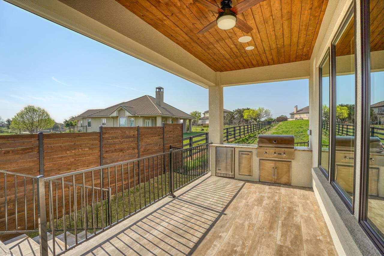Love the wood planked ceiling and outdoor grill. Ready for your next barbeque?