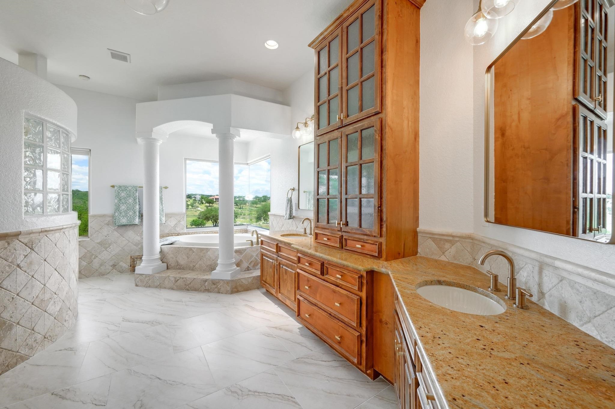 Spa bath with views, walk-in shower, double vanity