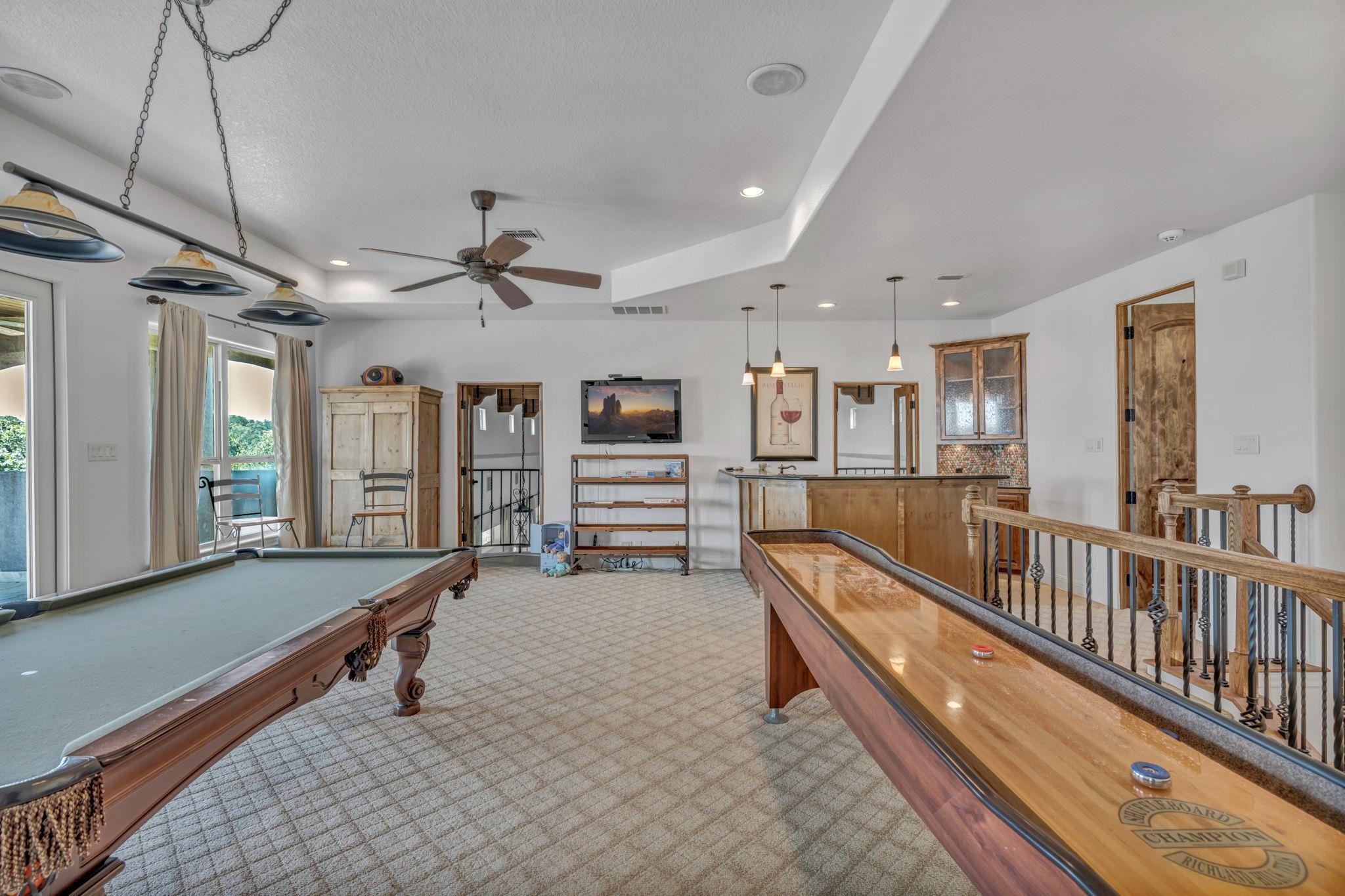 Sufficient space for multiple indoor game equipment with a wetbar