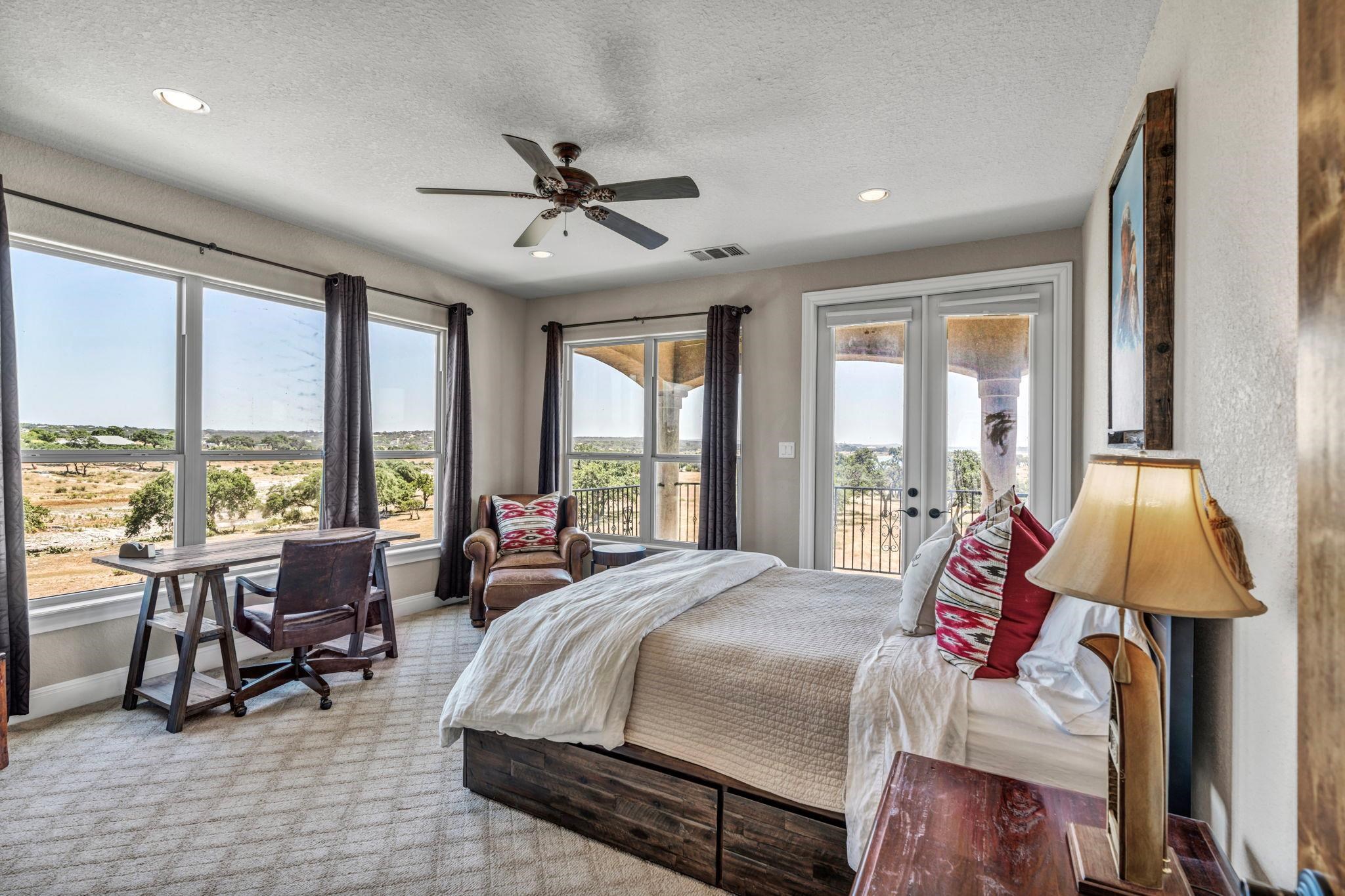 Bedroom with a view! Plenty of space and natural light with walk-out balcony
