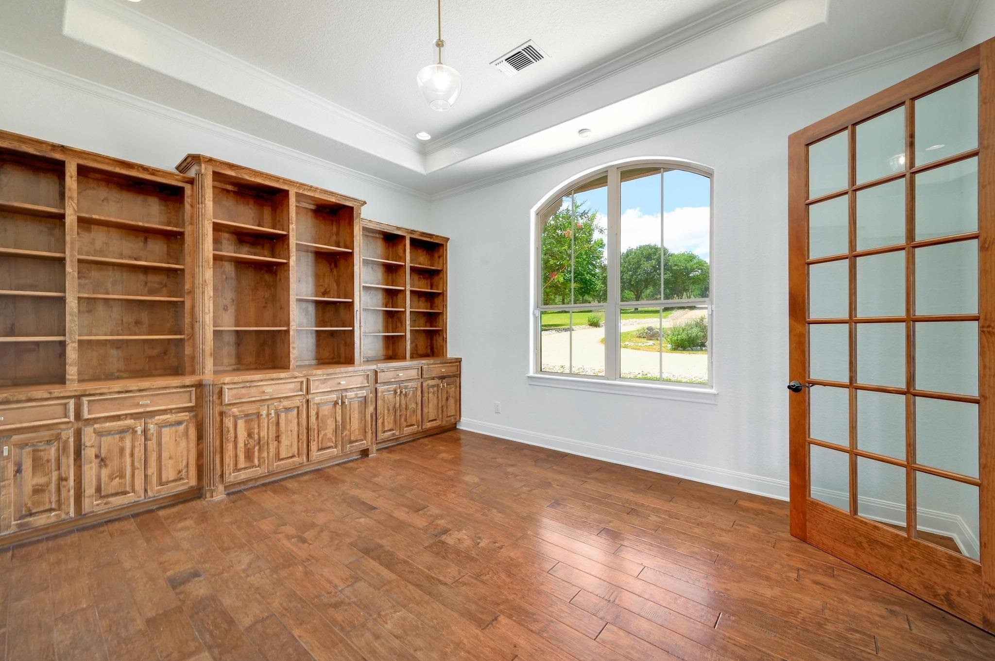 One of two formal study/office with built-in natural wood