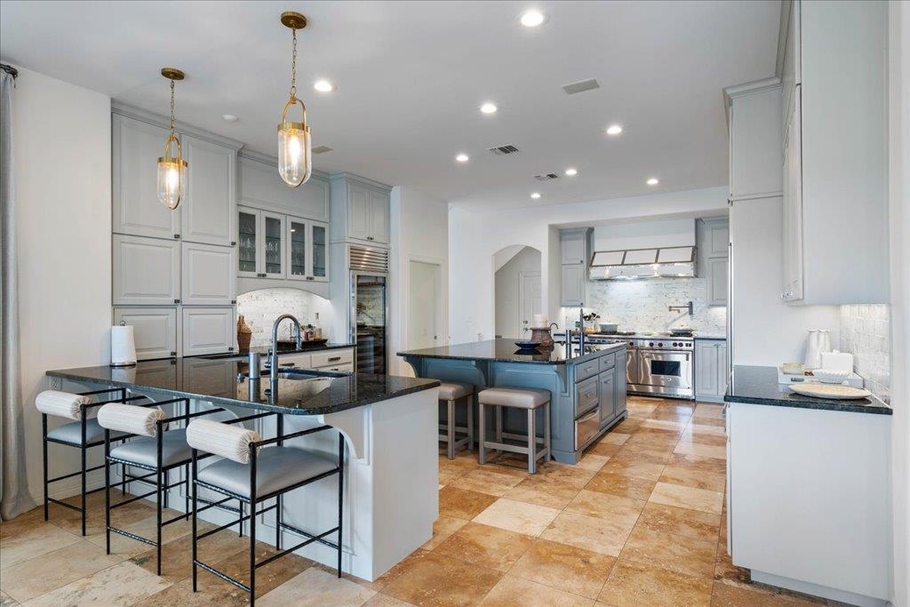 This kitchen has everything a cook will want including double sinks and double dishwashers.