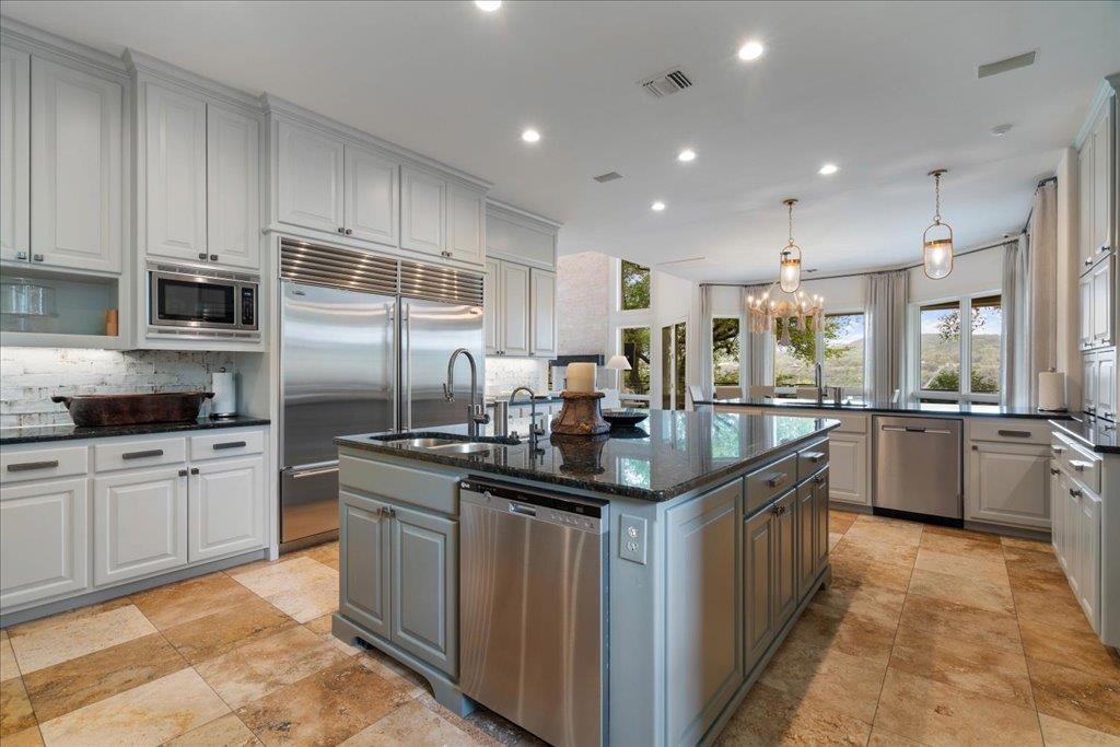 Note the double Sub-Zero refrigerators and double dishwashers.