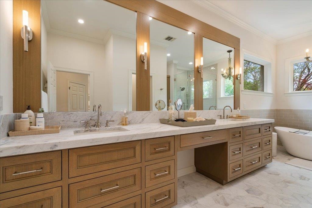 Lavish bathroom with elegant lighting and fixtures.
