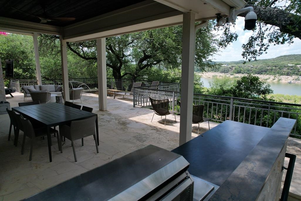 Expansive stone patio with splash pool