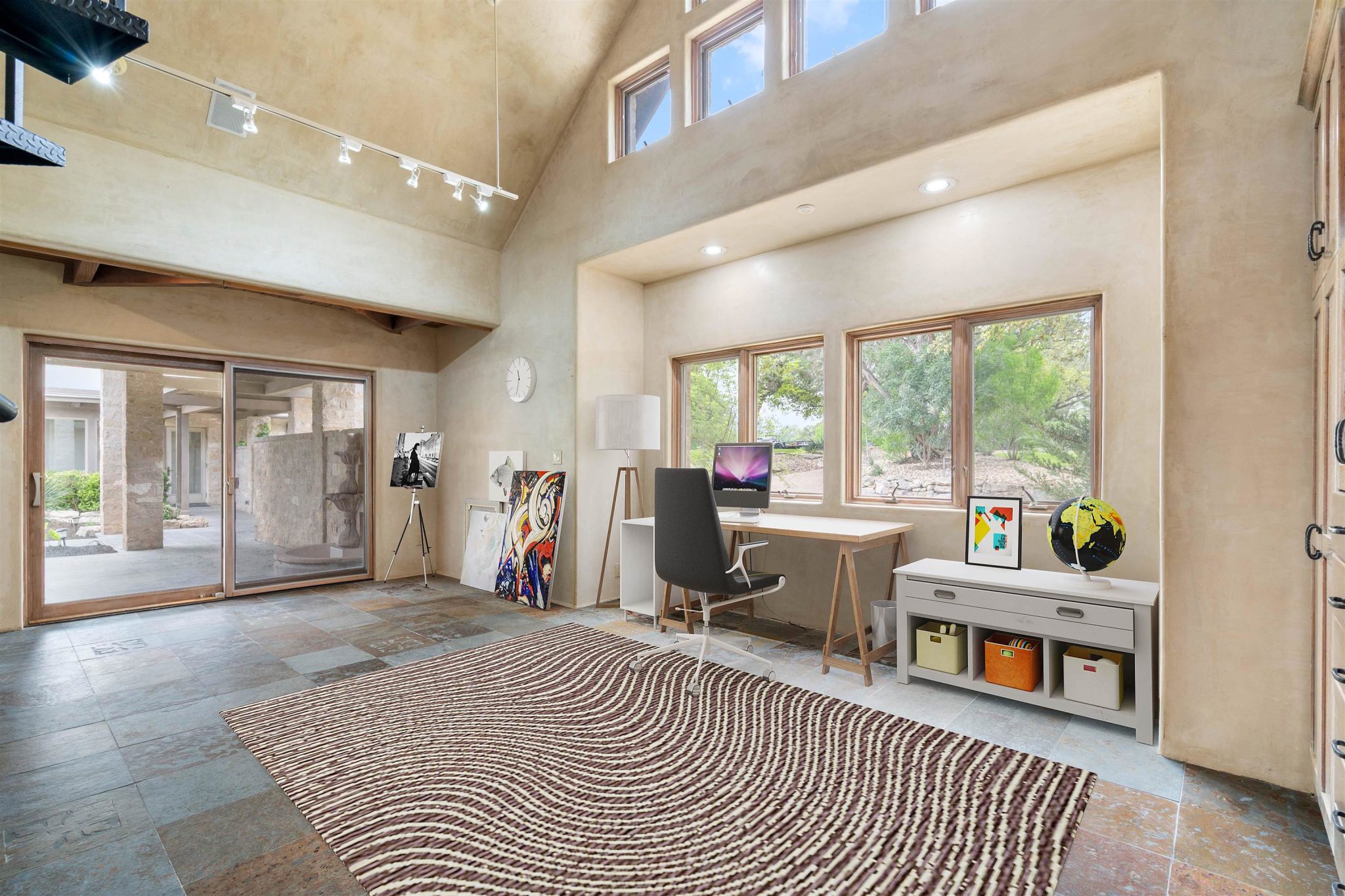 4th bedroom also makes a nice studio with the abundance of natural light. (Virtually staged)