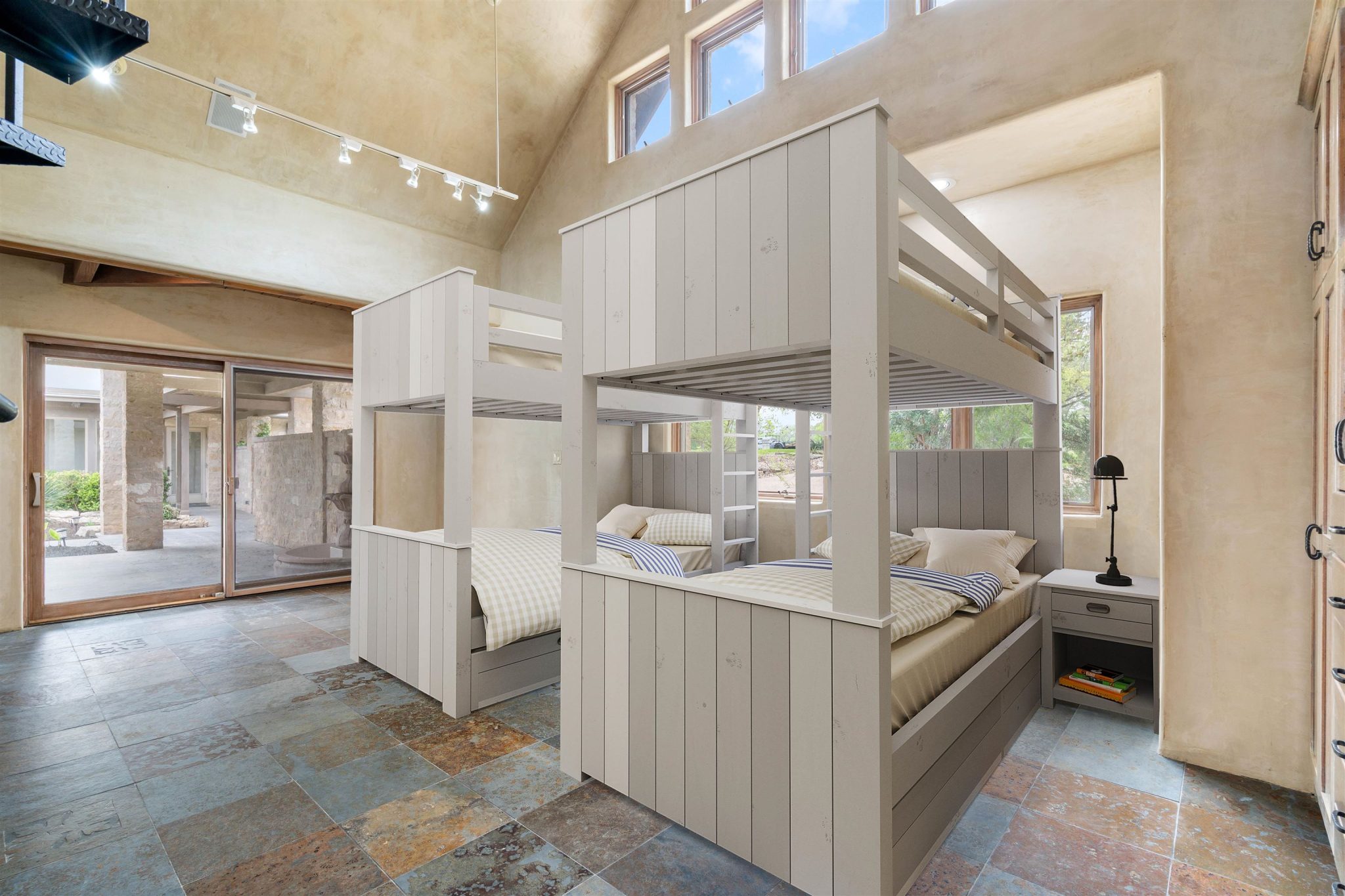 4th bedroom staged as a bunk room.  (This is the room that also has the spiral stairs to the loft.)