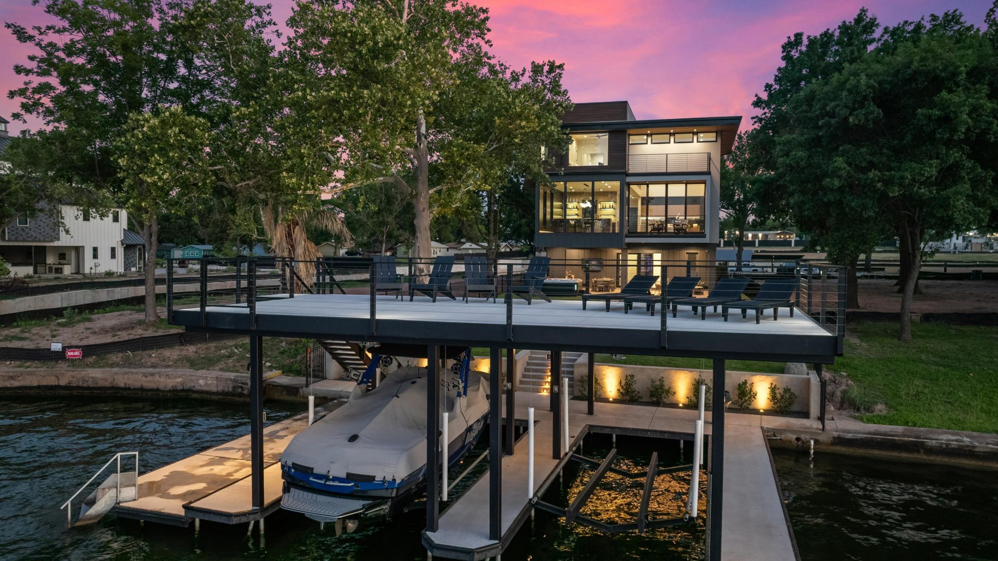 2 boat lifts & rooftop deck for lounging and taking in the lake views.