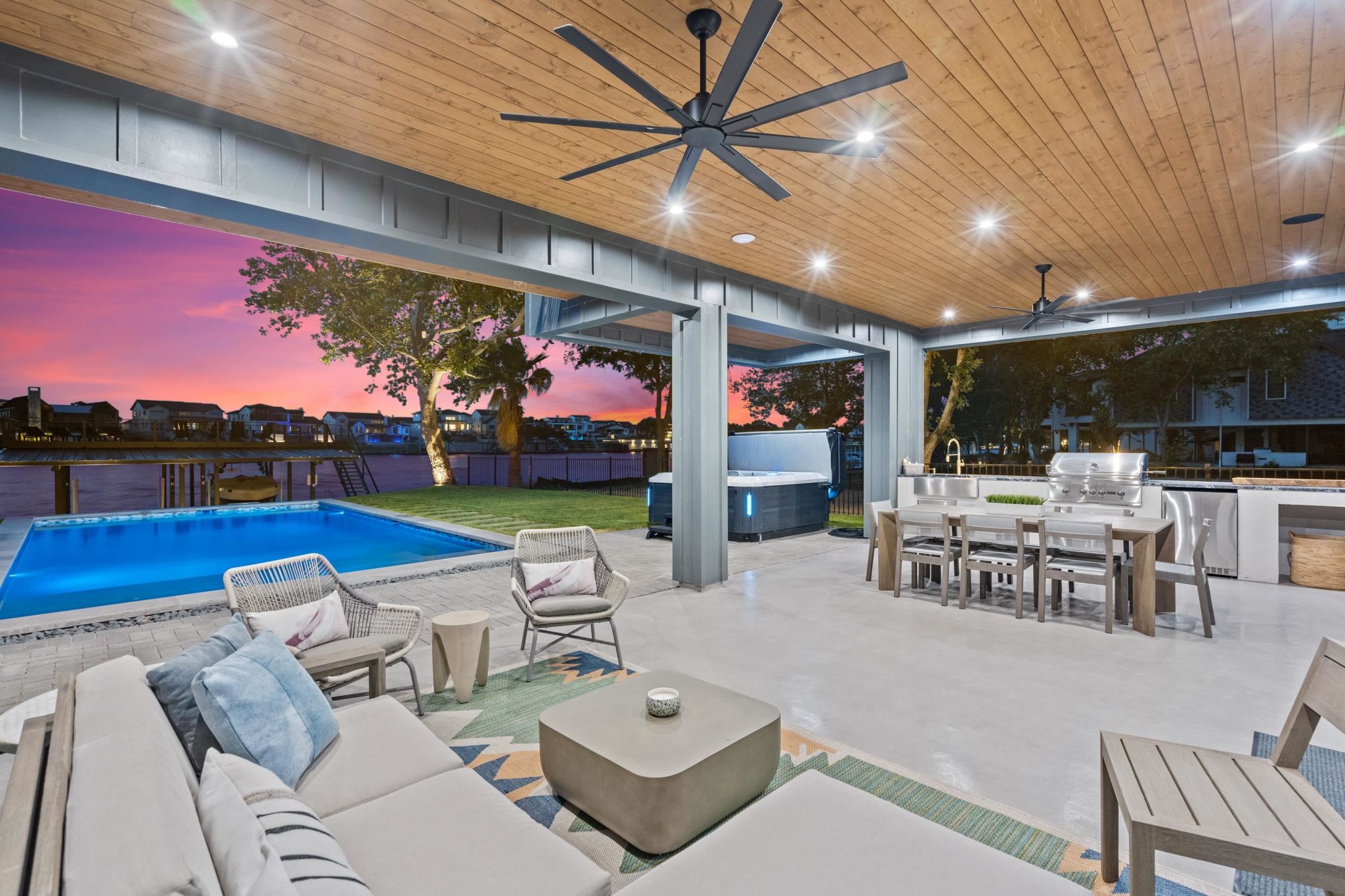 Built-in outdoor kitchen for elevated lakeside dining, and a jacuzzi tub