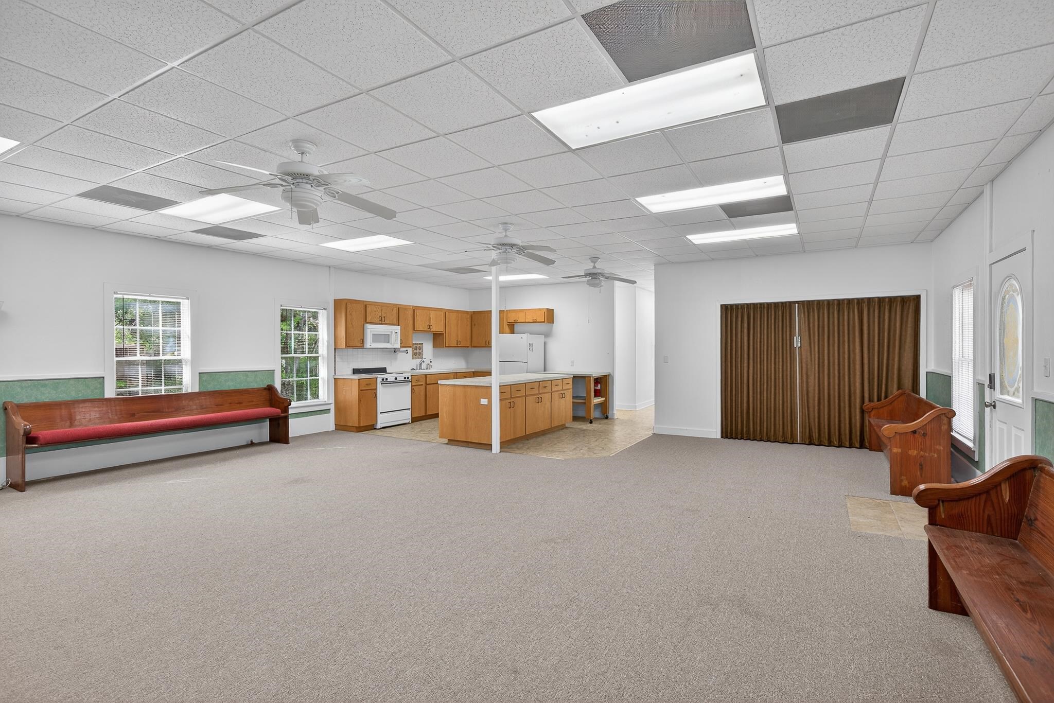 Banquet/Fellowship Hall/Room with divider and kitchen.