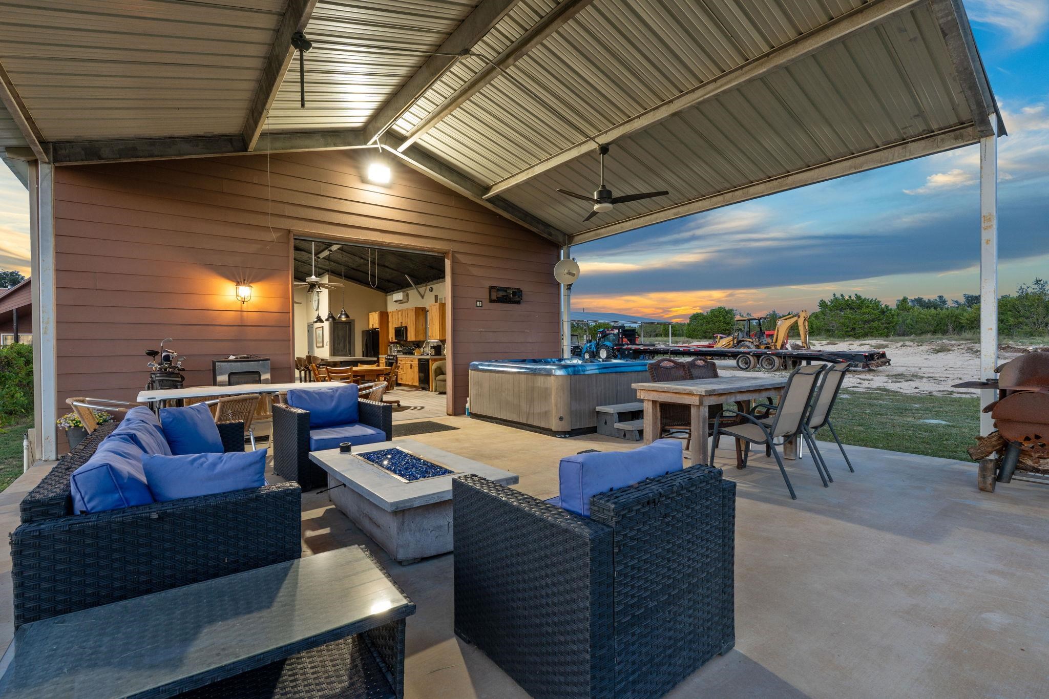 With a hot tub, seating and propane fire pit