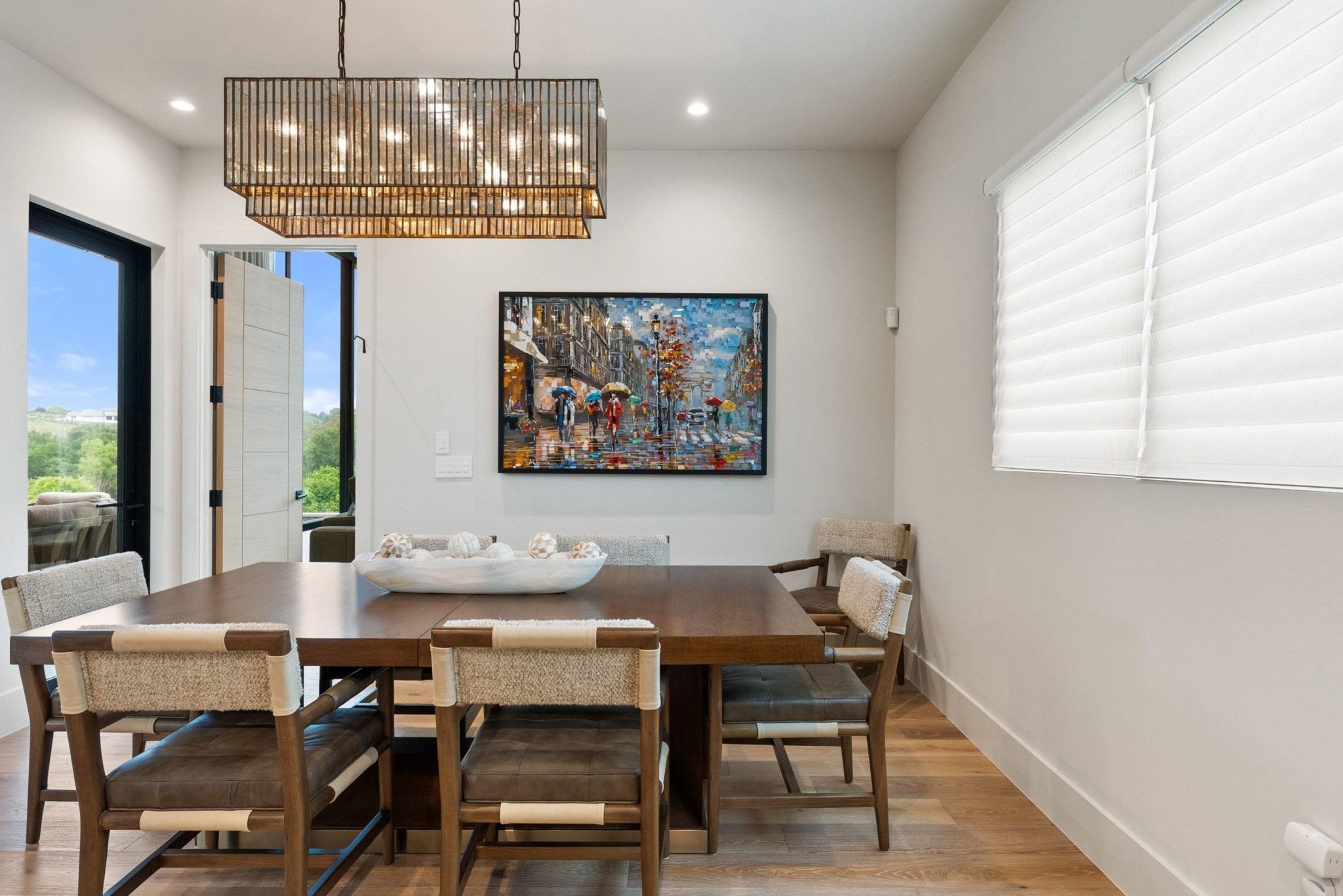 The home features soaring ceilings, gallery-style art niches and the views!