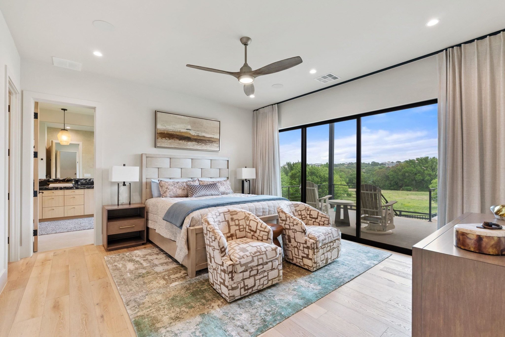 The downstairs primary bedroom offers view and its own private patio.