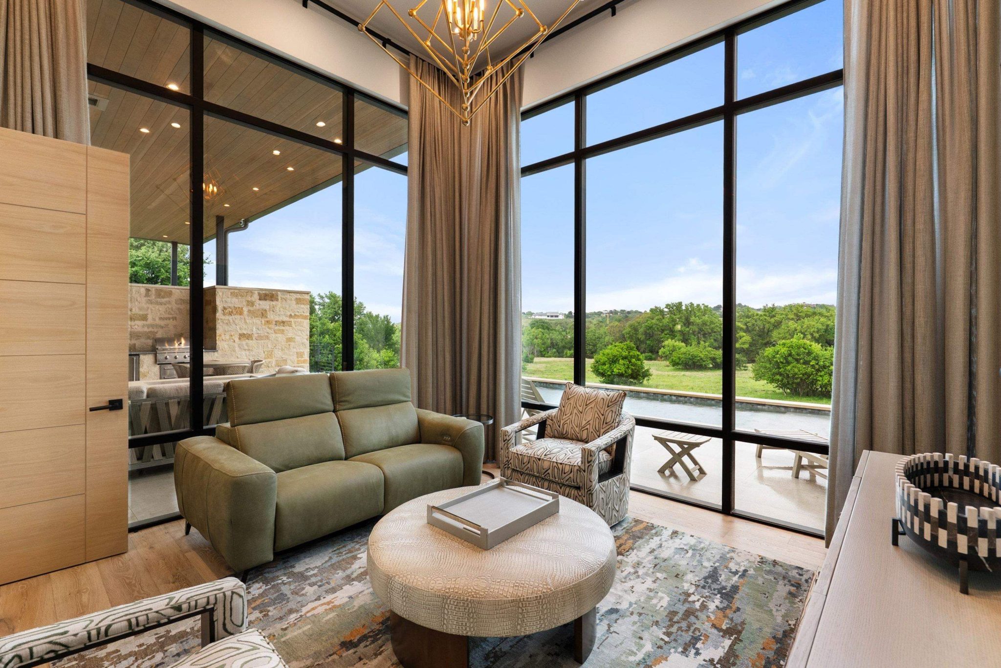 With views to the back and the pool, this secondary living room could serve as a media or an office