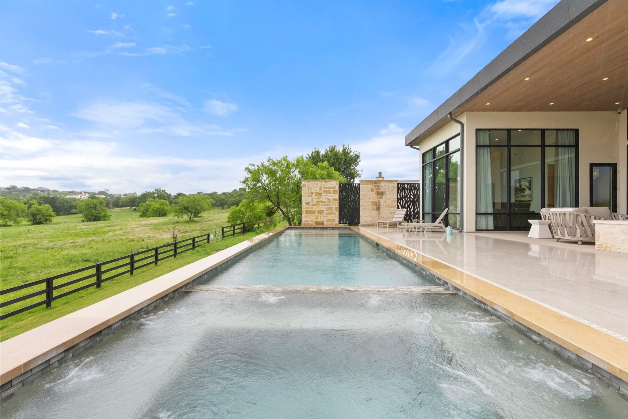 Great lap pool with a spa, located right off the back patio