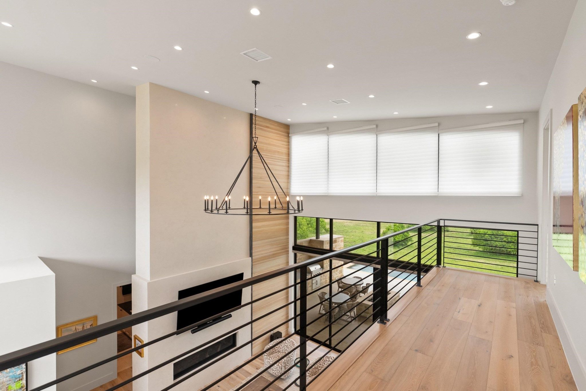 Upstairs hosts the additional 2 secondary bedrooms and ensuites, custom iron railings offer views