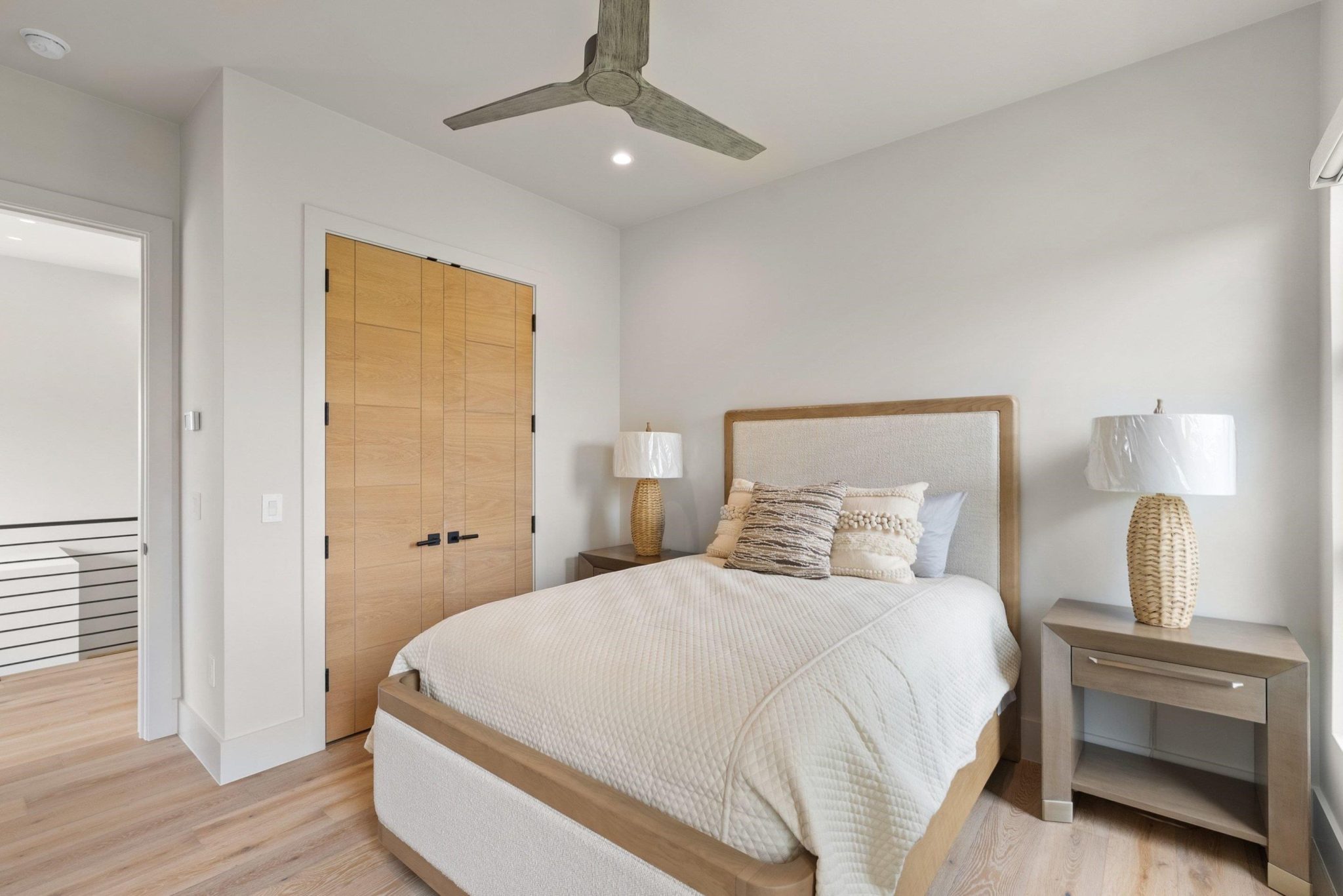 Secondary bedrooms upstairs, with a walk in closet and ensuite full bath and automated blinds