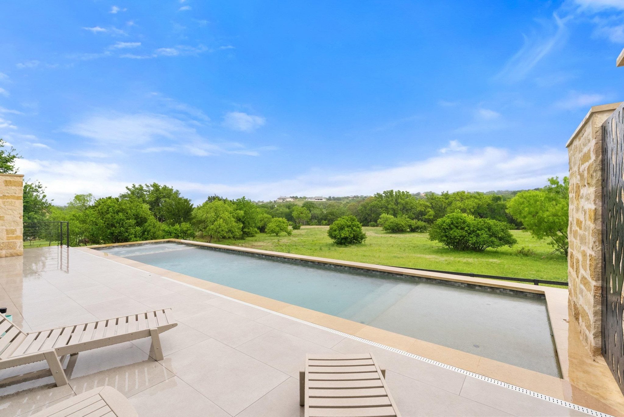 Overlooking pastureland and framed by Texas Hill Country beauty creates a breathtaking setting