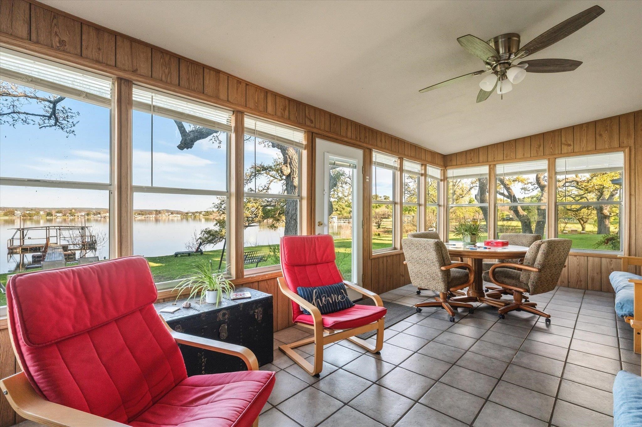 This sunroom has 3 sides of windows and then open to the kitchen and dining area.
