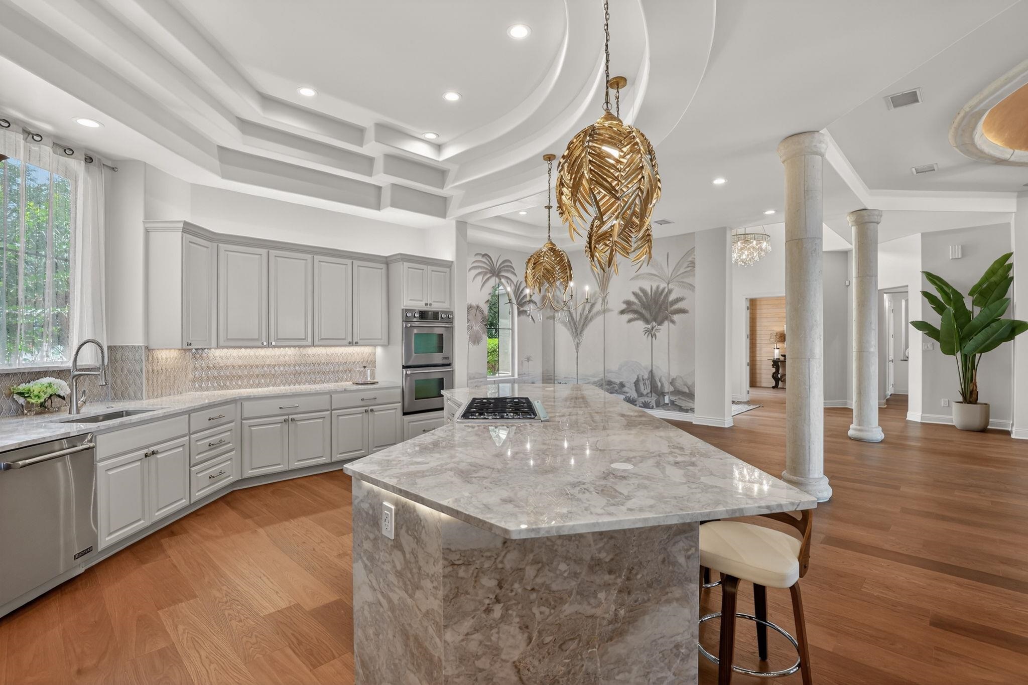 COUNTERTOPS & ISLAND/BASE OF NATURAL STONE! EXTRA LIGHTING, STORAGE, GAS COOKTOP, STAINLESS, PANTRY!