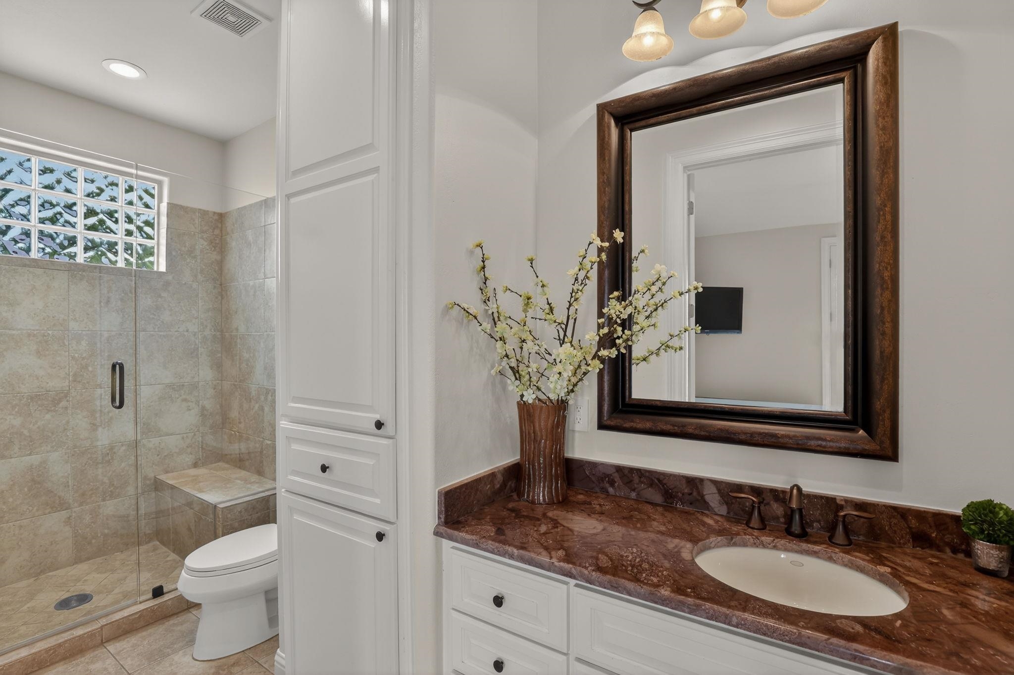 1 OF 3 PRIVATE GUEST BATHROOMS. THIS ONE IS IN THE WATERFRONT ROOM WITH BALCONY!