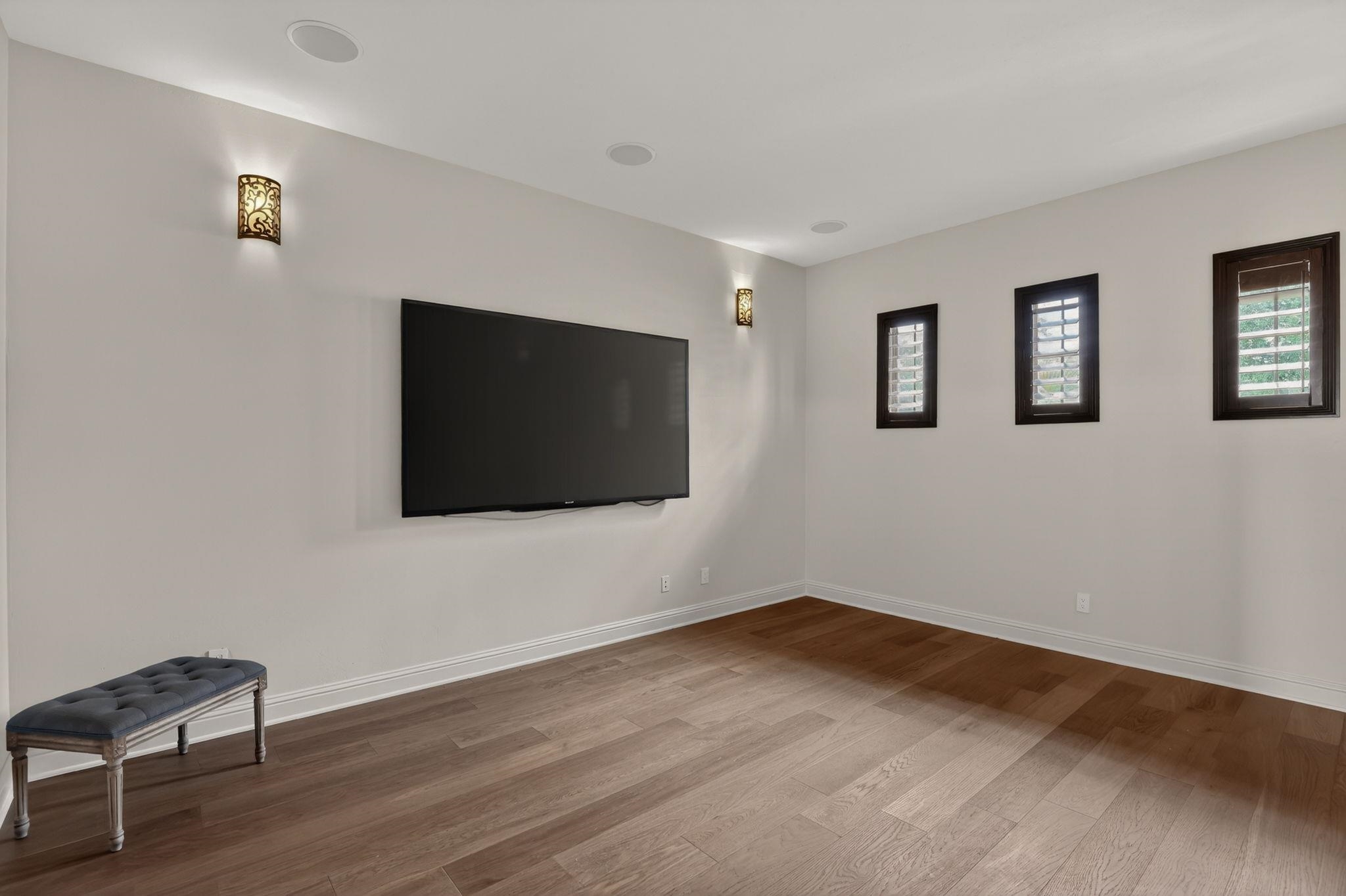 WHAT A GREAT ADDITIONAL ROOM FOR MOVIES, MEETINGS OR EXTRA GUESTS! TRULY A BONUS, MULTI-USE SPACE!