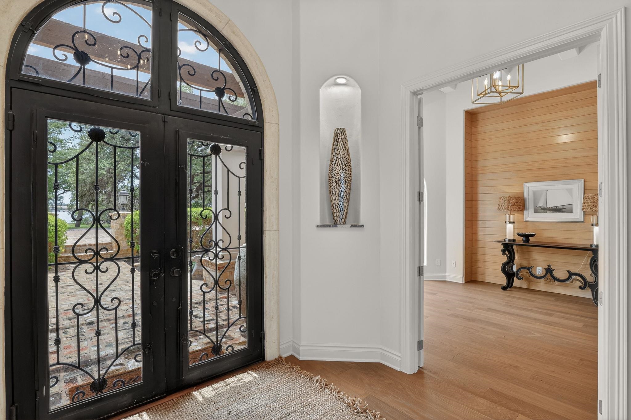 AT FIRST GLANCE, IT'S THE MASSIVE IRON DOORS, EUROPEAN OAK FLOORS & SOPHISTICATED LIGHTING!