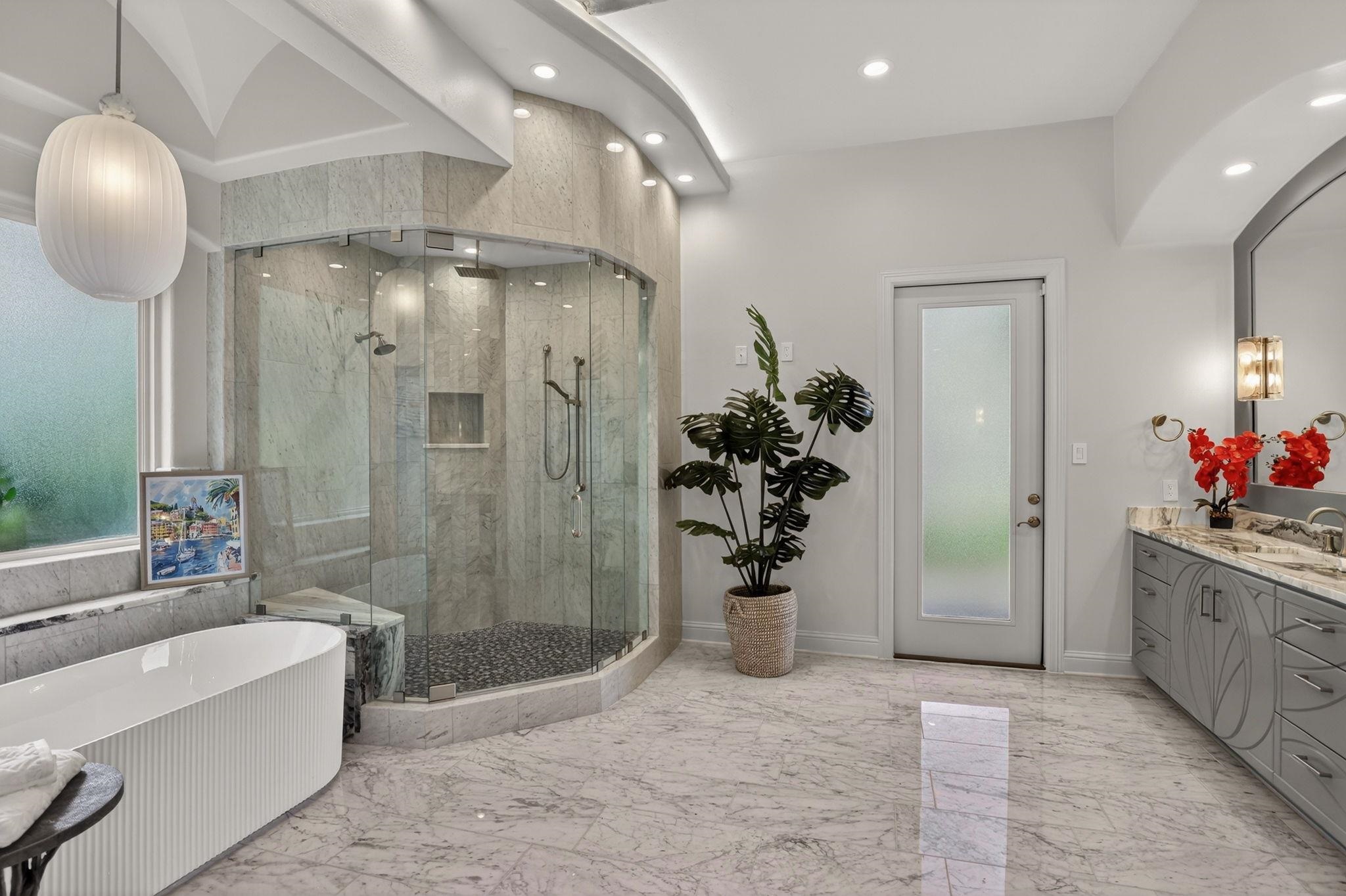 SPLENDID MARBLE & GRANITE, GLASS TILE, FLUTED TUB & LIGHTS. ACCESS TO PATIO WITH LAKE VIEWS!