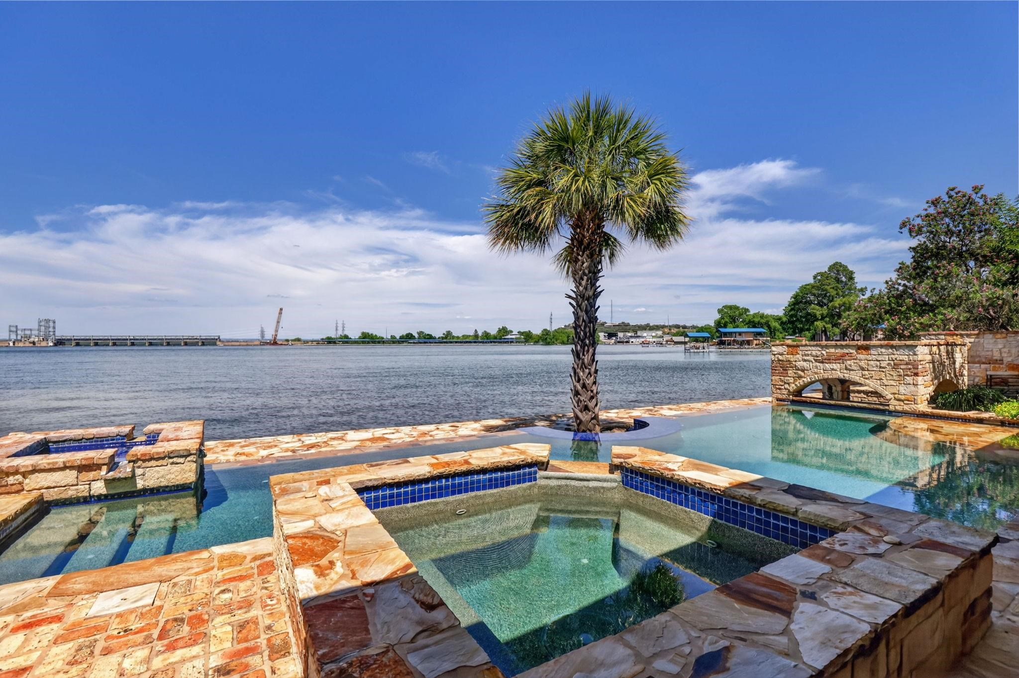 RELAX TO THE SOUND OF FOUNTAINS, SWIM IN YOUR OWN GROTTO, SOAK IN THE HOT TUB OR SPLASH AWAY!