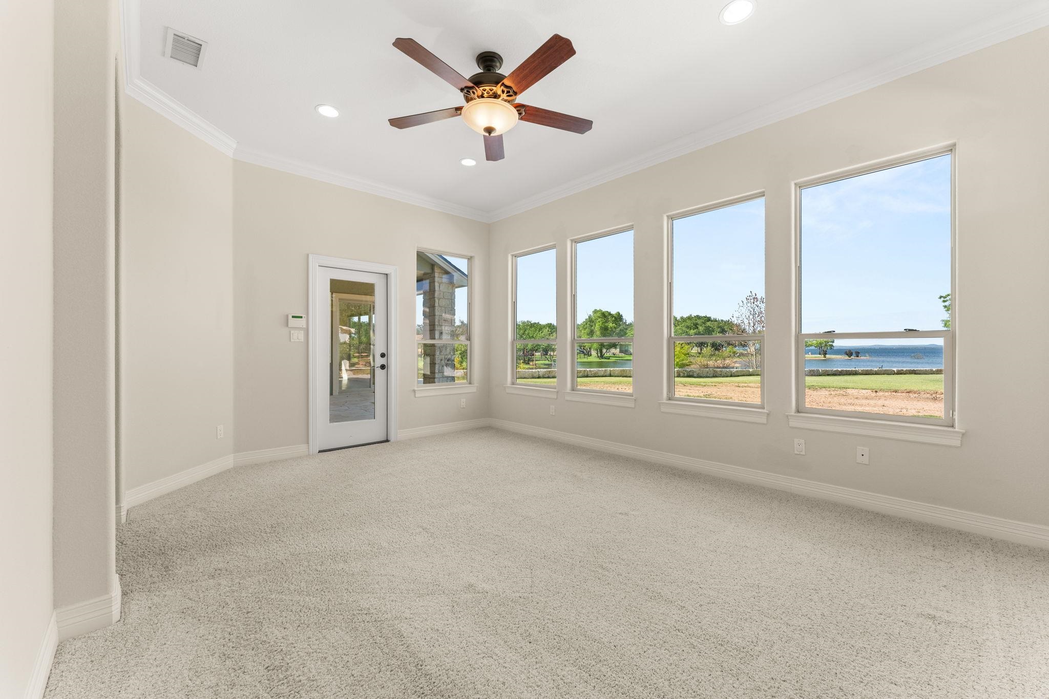 Master Bedroom with many windows with lake view.