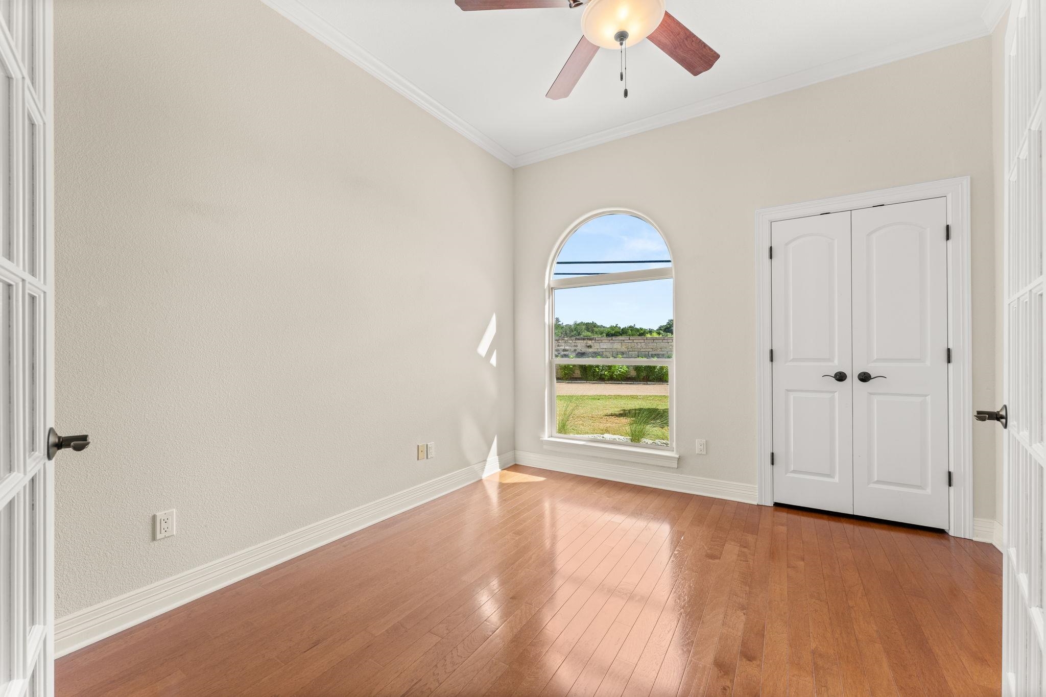 Study with ceiling fan and closet.  Could be used as a fourth bedroom