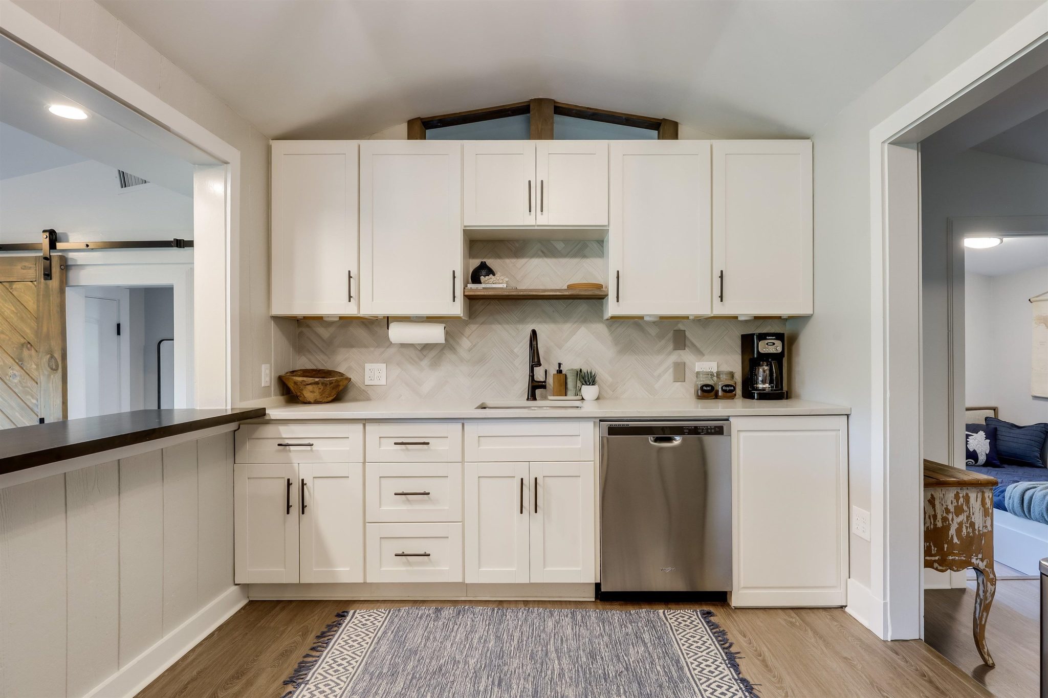 Beautifully remodeled kitchen with stainless steel appliances and stylish backsplash