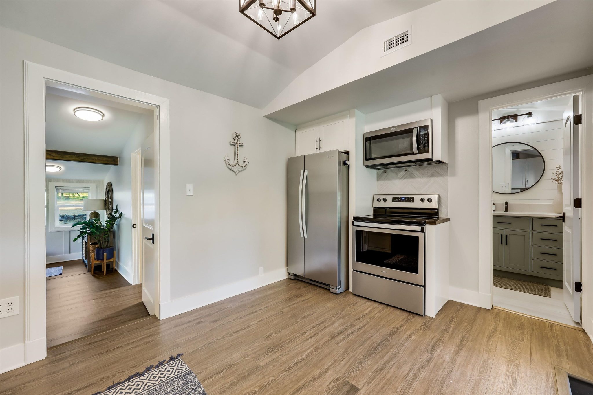 Beautifully remodeled kitchen with stainless steel appliances, stylish backsplash