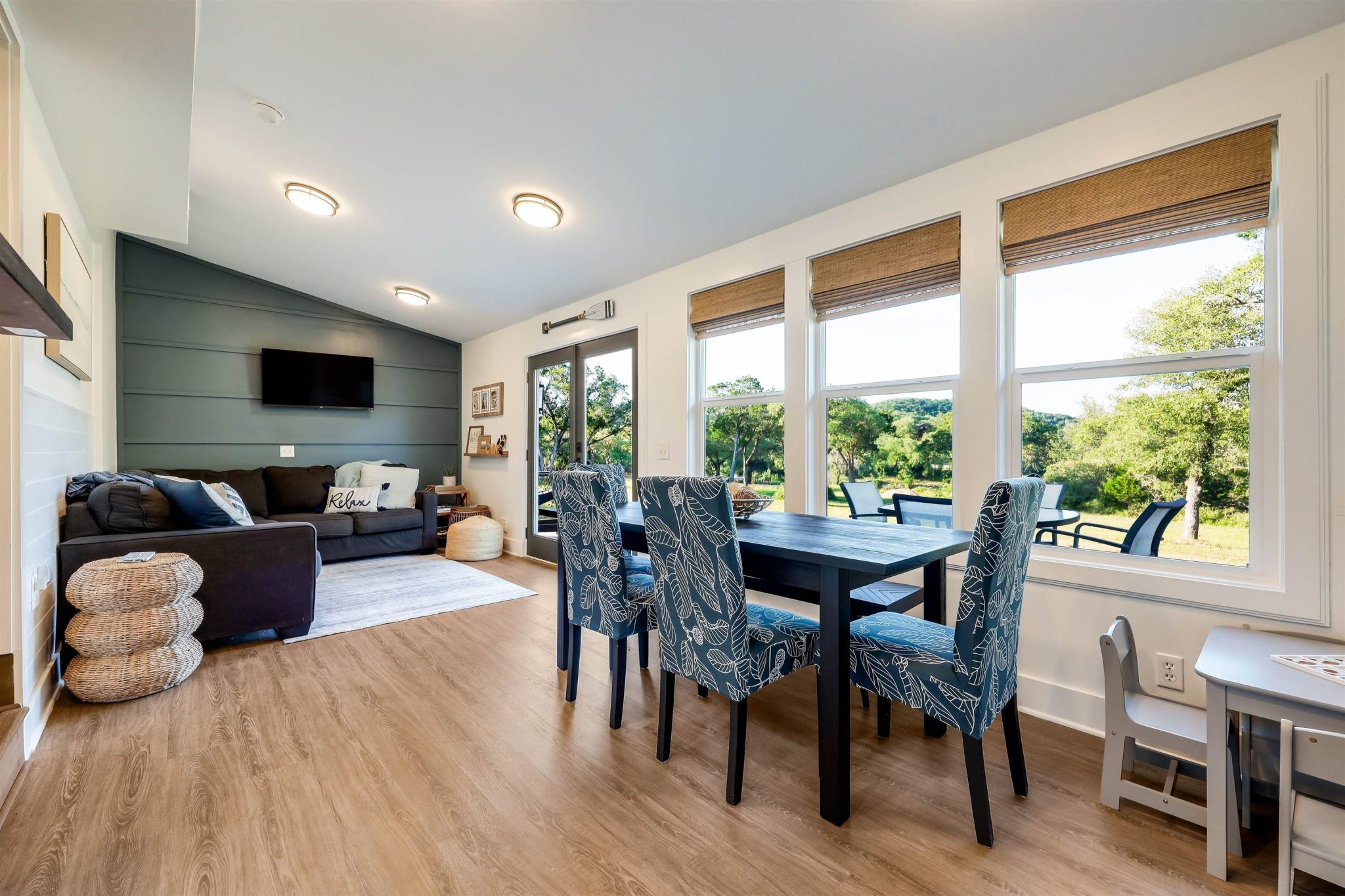 Dining area is open to kitchen and living area. French doors lead out to the back deck.