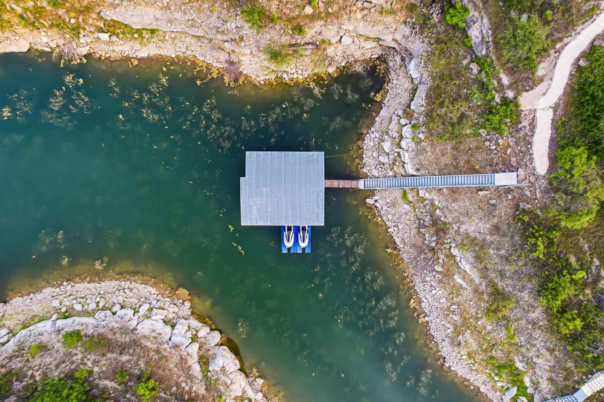 Galvanized metal stairs lead to the dock