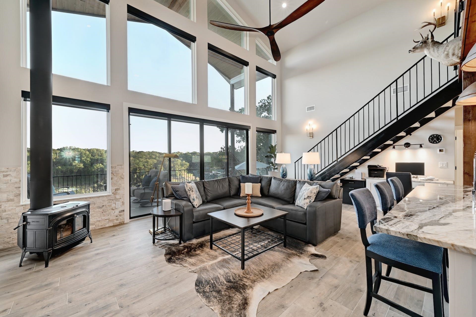 Expansive windows frame breathtaking views of the lake.