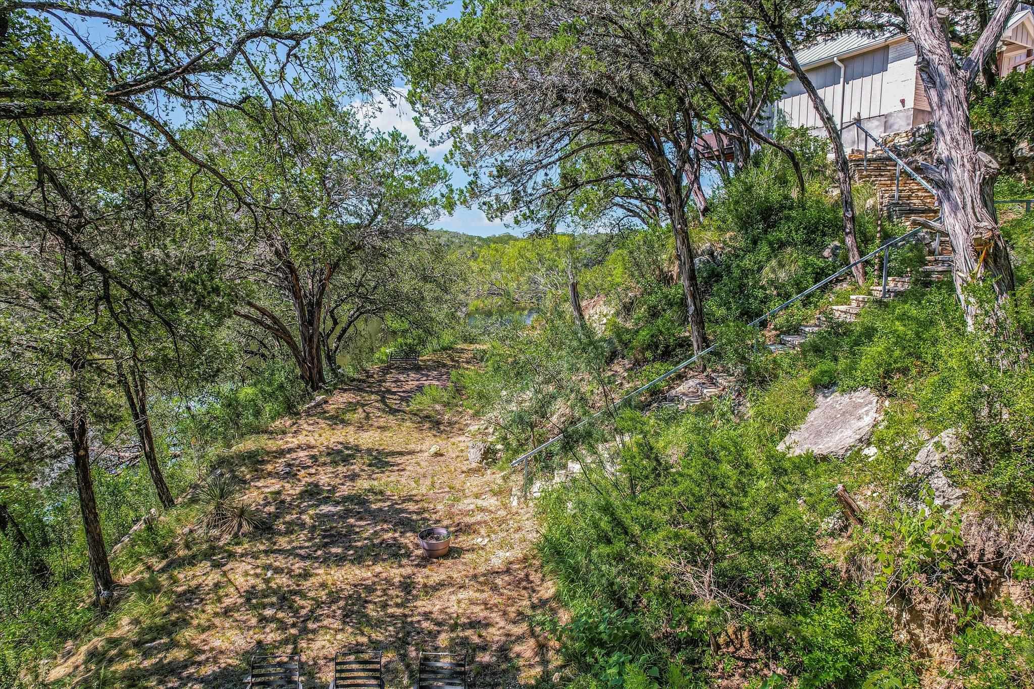 Lush walkway to boat dock.  Perfect surroundings for an evening barbeque, picnic or a twilight swim.