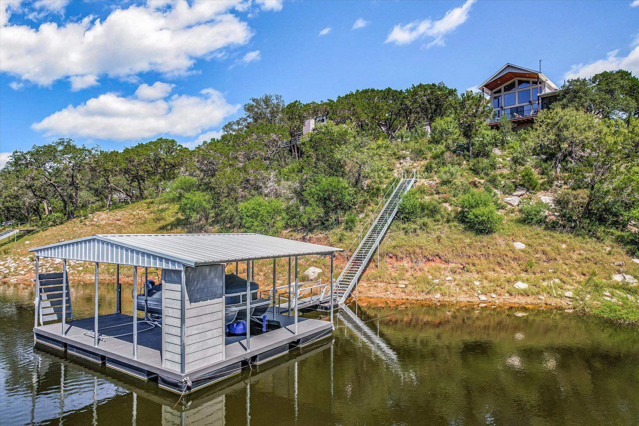 Boat dock complete with an 8,800-pound HydroHoist® boat lift for effortless days on Lake Travis.
