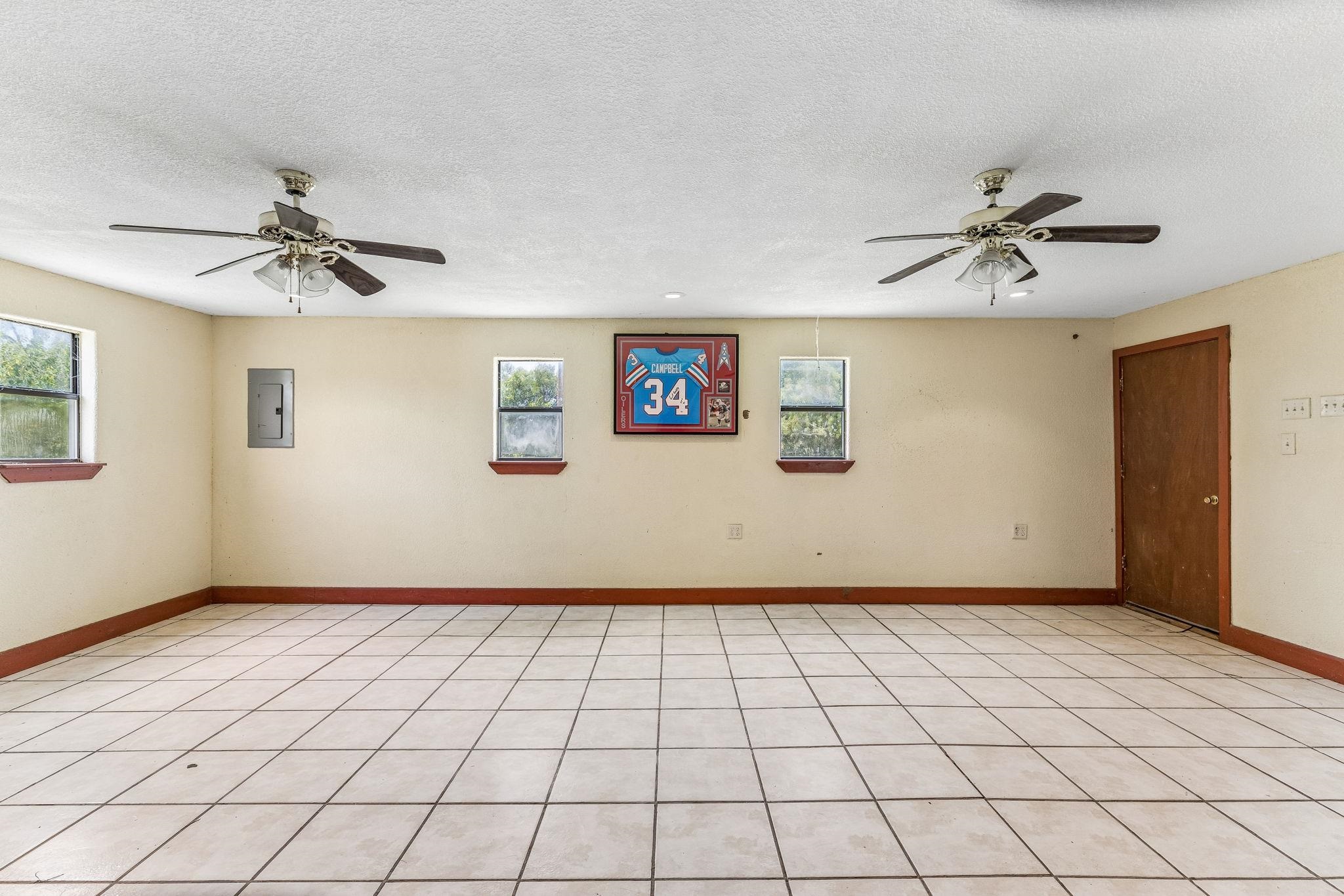 Tiled flex / entertaining space with a kitchenette and its own entry, add the extra room for guests