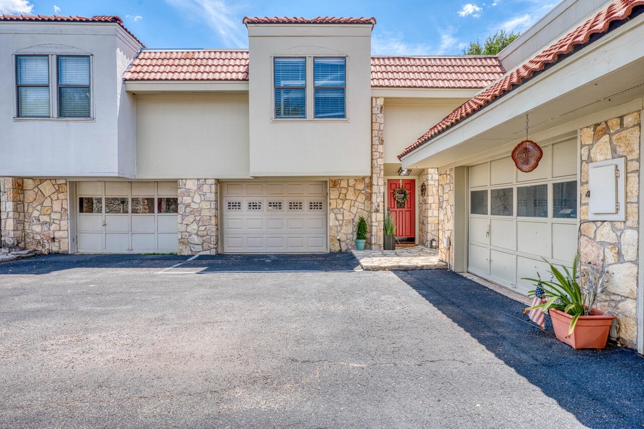 parking in front of garage and behind property