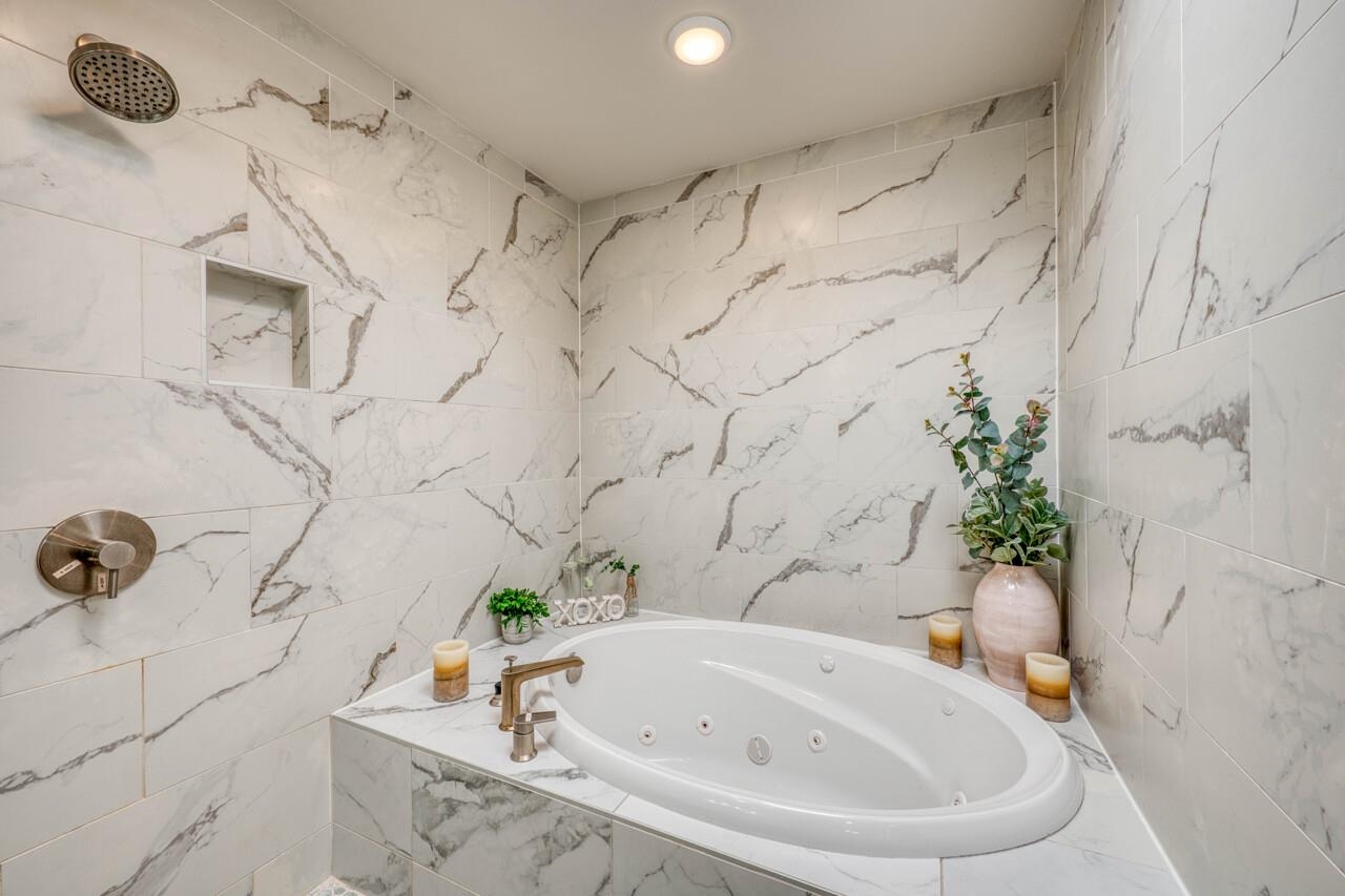 Fully renovated primary bath with walk in shower/wet room