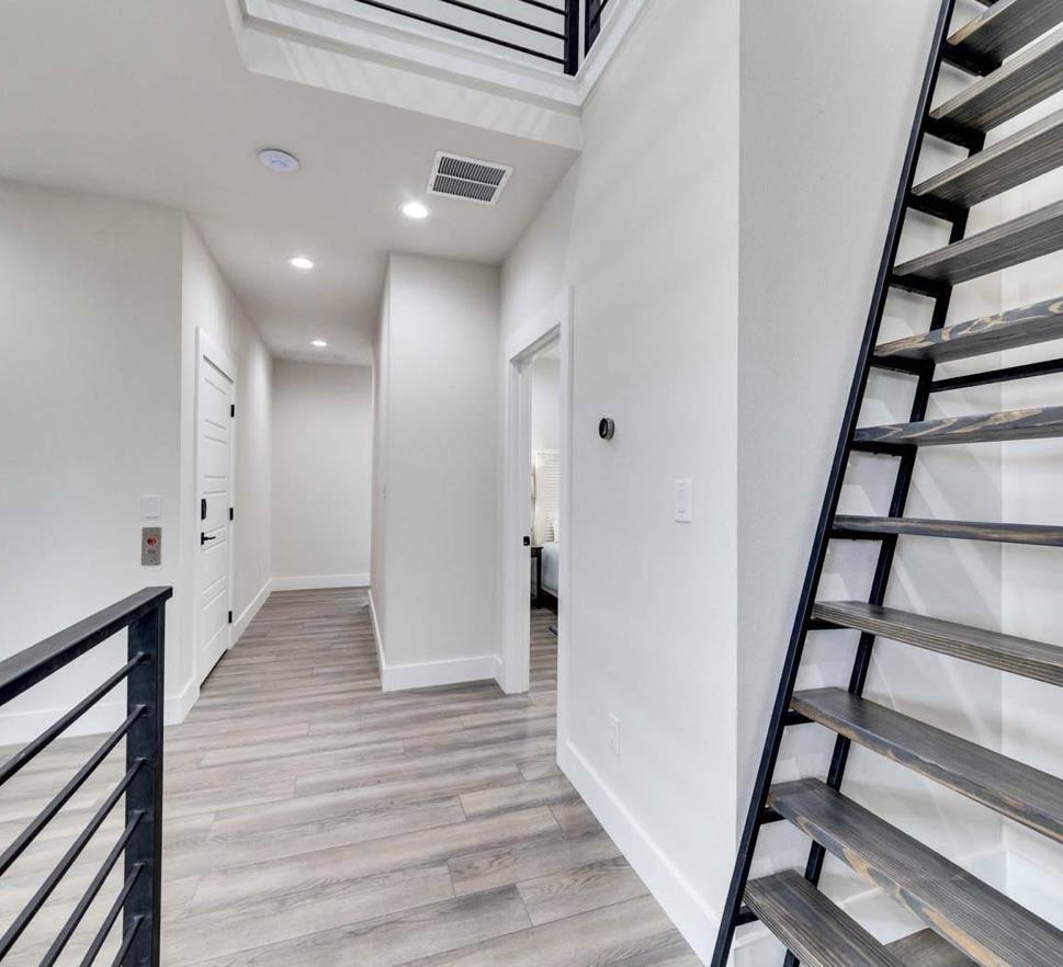 W/ stair access to 4th level loft area/bedroom #5