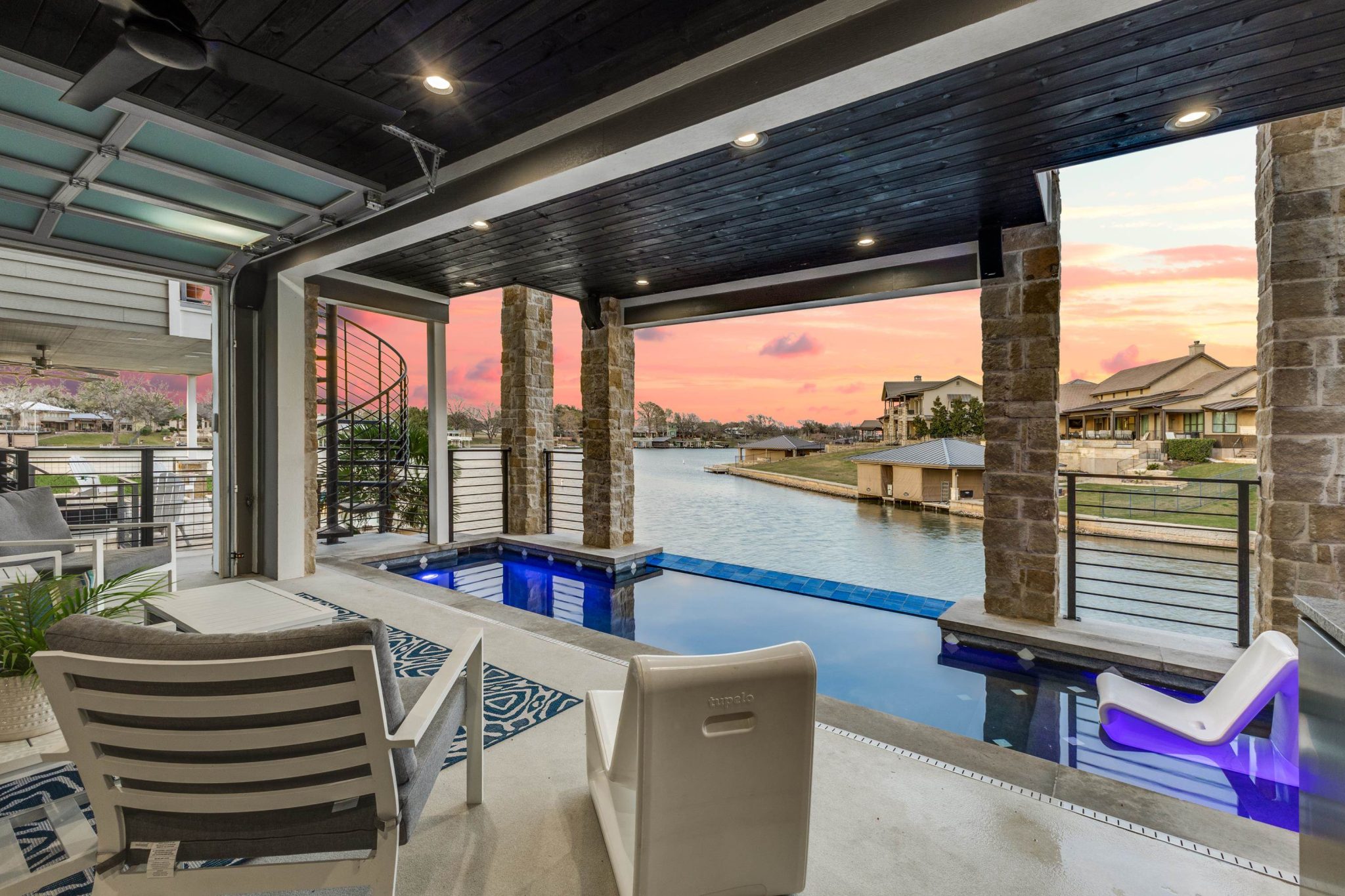 With roll up garage door on one side for privacy.
