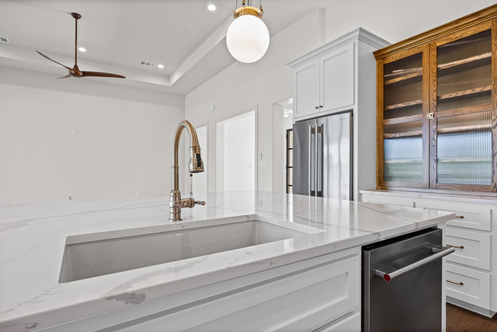 Contemporary features, large integrated sink, and contemporary appliances with elegant cabinetry