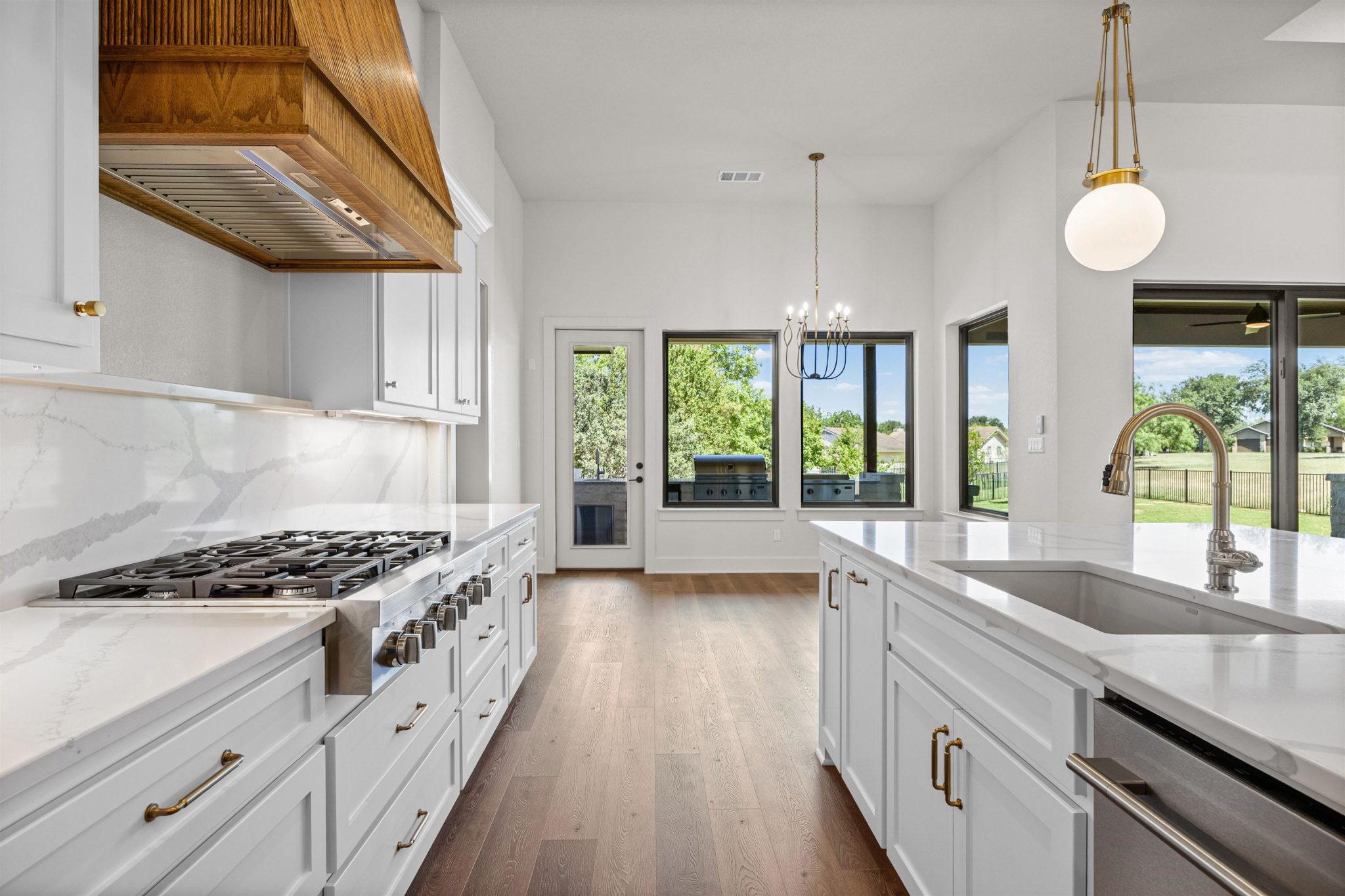 Open concept with elegant counters and premium appliances