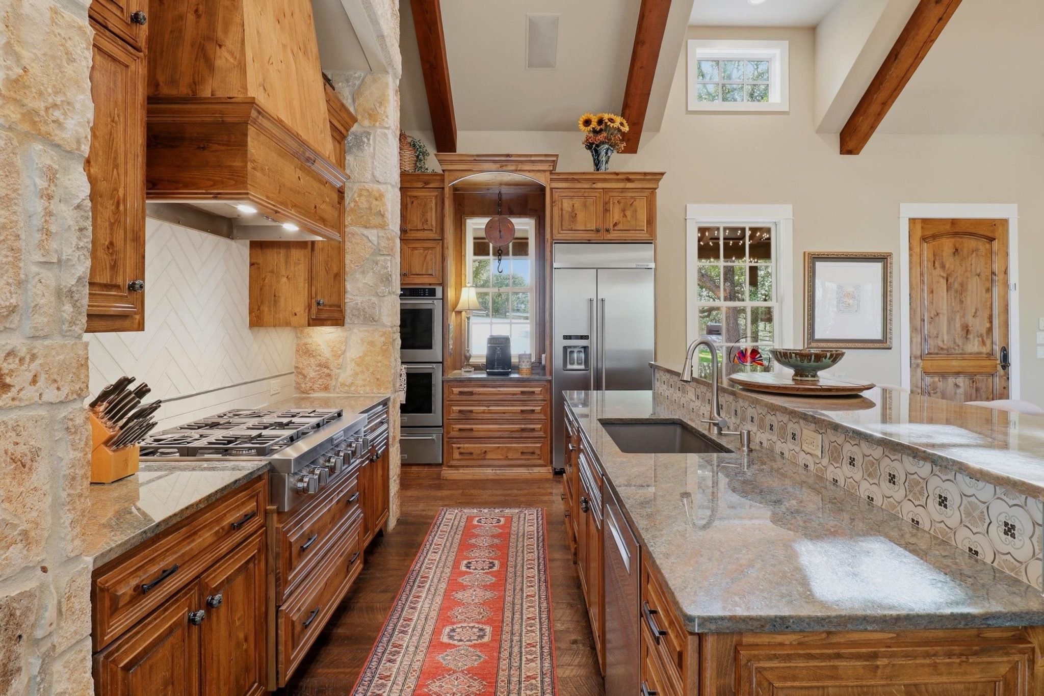 Generous cabinetry and workspace combine function with warm Hill Country style.