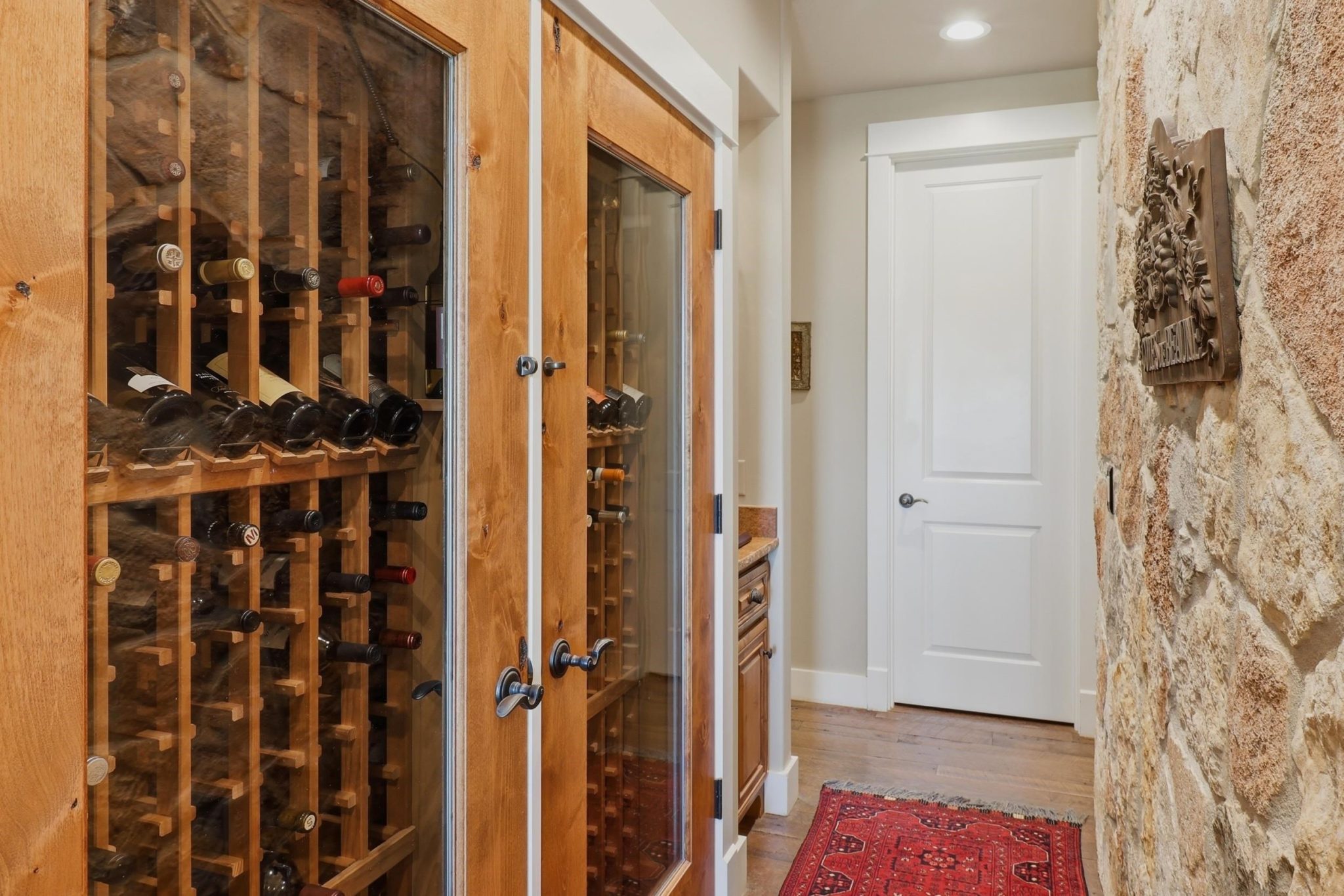 Distinctive rock wall creates a memorable feature just beyond the kitchen.